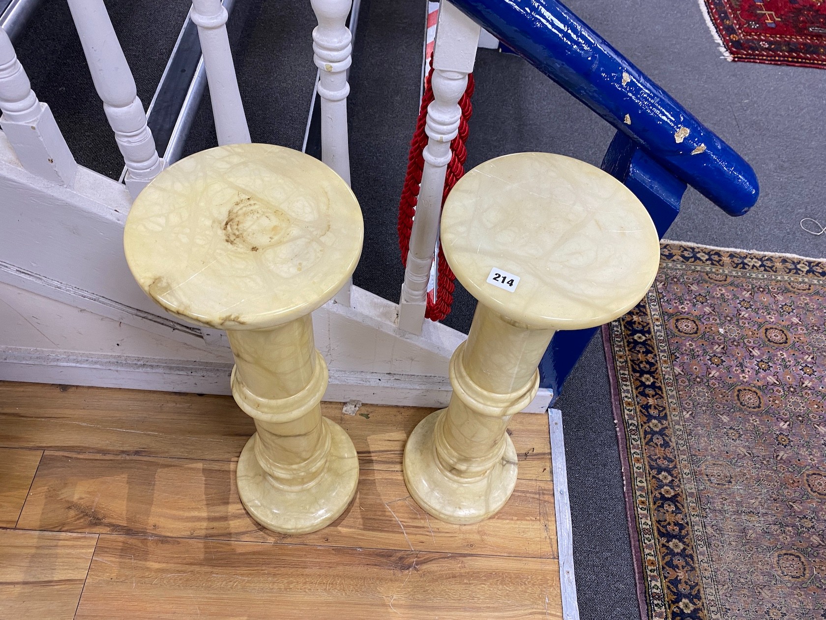 A pair of alabaster pedestals, height 78cm